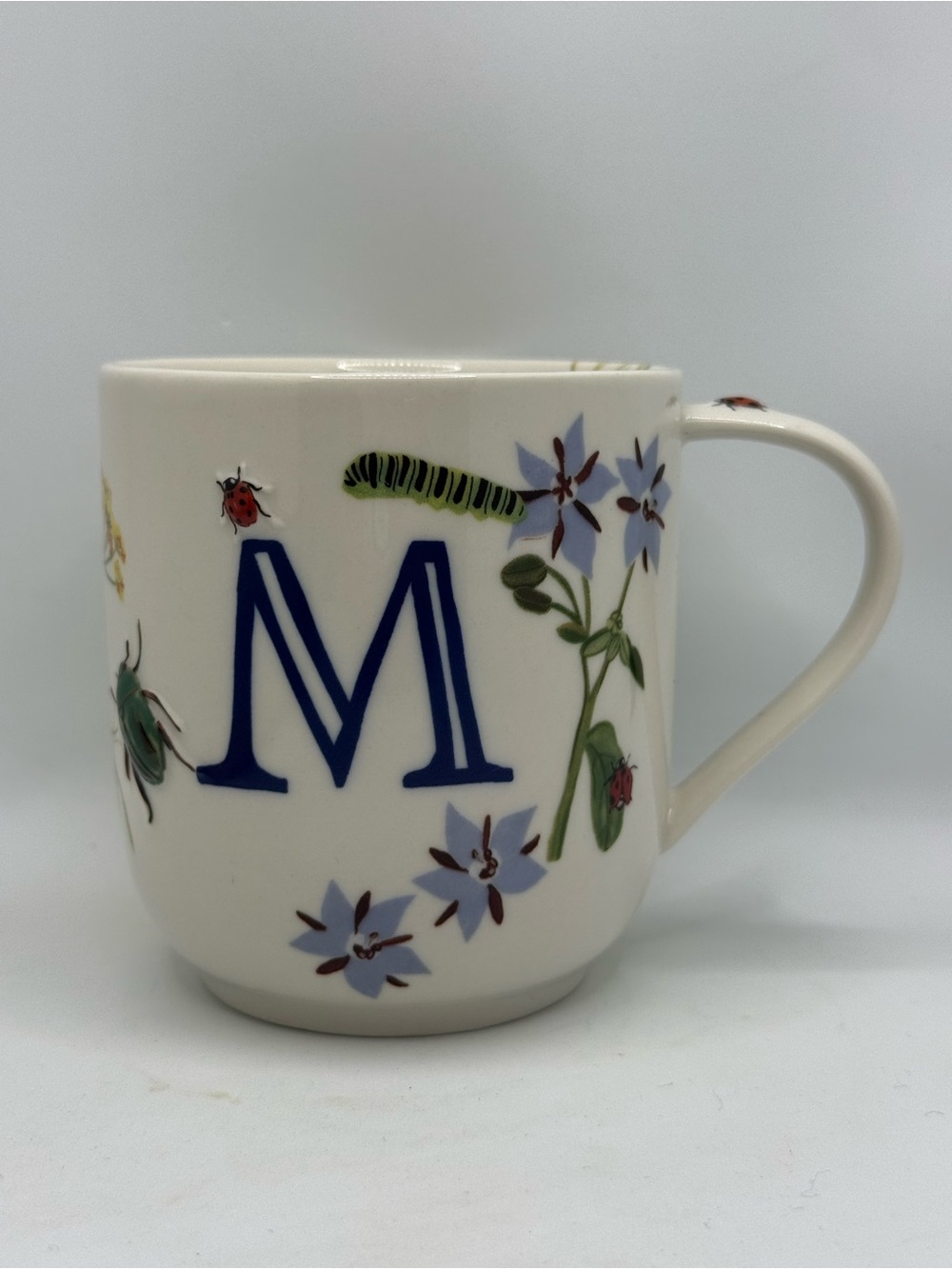Anthropologie Monarch Monogram mug featuring a bold navy letter 'M'